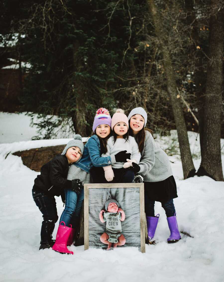 The Chaver's sisters pose with a picture of baby Sterling. 