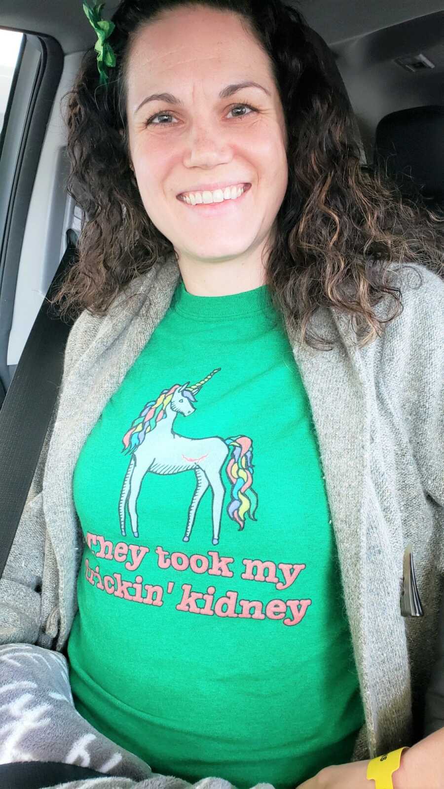 Erin wears a unicorn shirt saying, 'They took my frickin' kidney.'