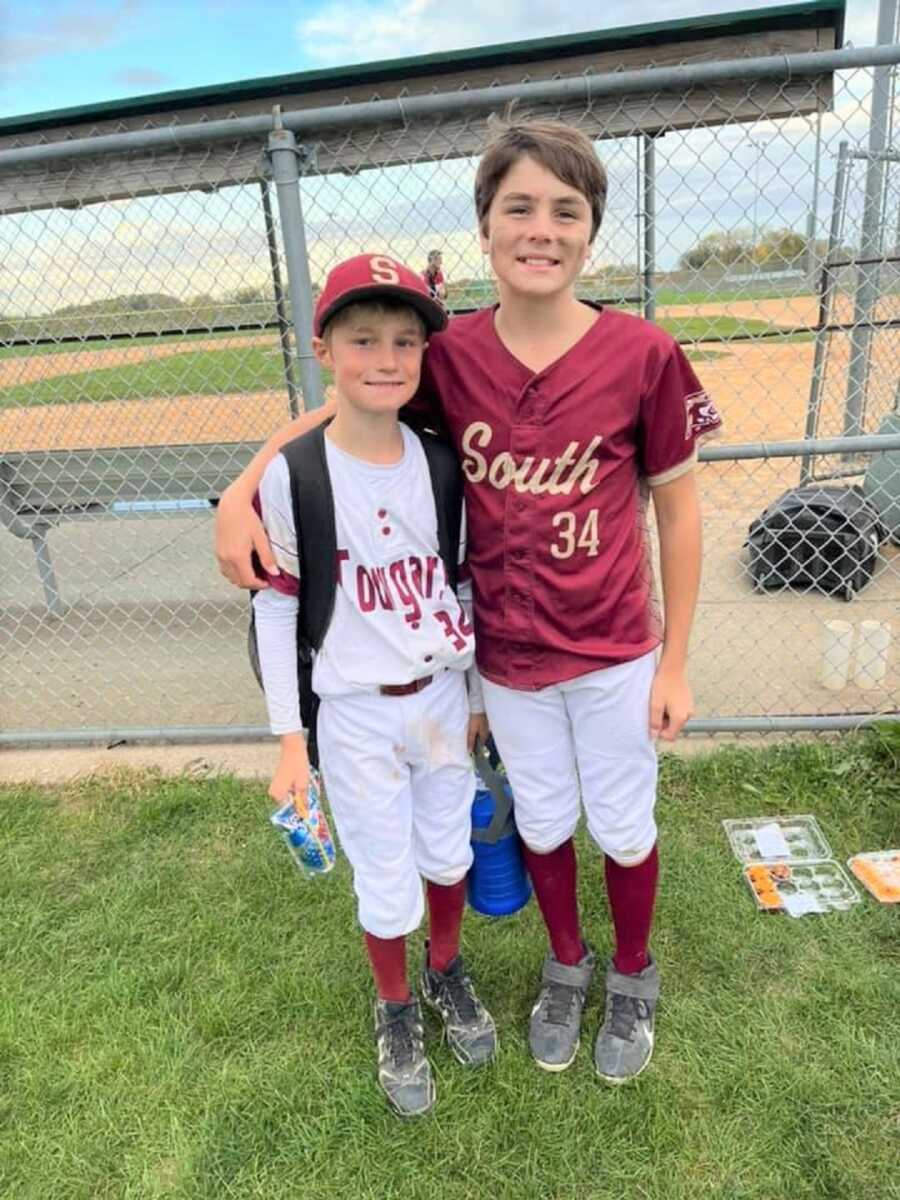 Bennett and Noah wearing their baseball uniforms. 