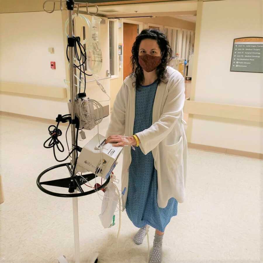 Erin walking around the hospital after her kidney donation surgery.