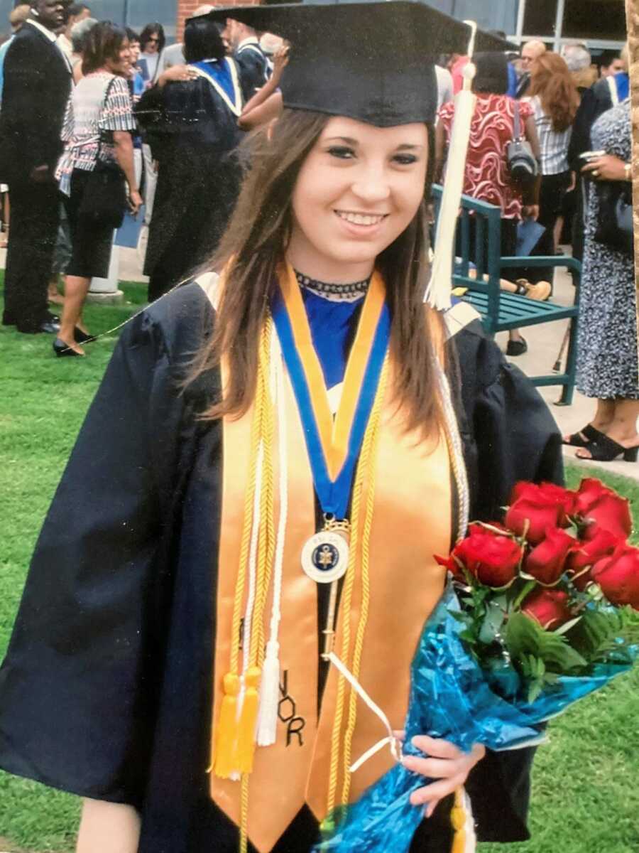 woman graduating college with a master's degree
