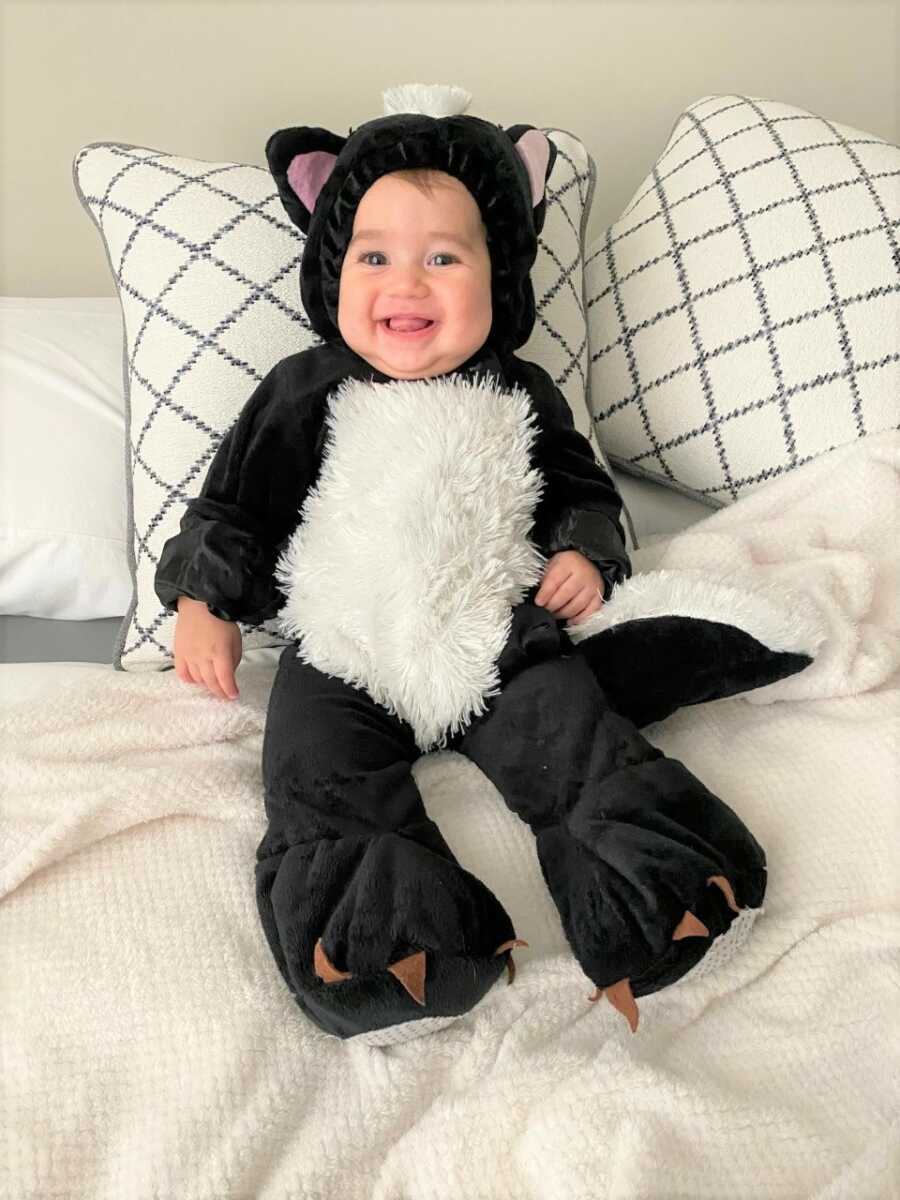 Sami dresses as a skunk for his first Halloween. 