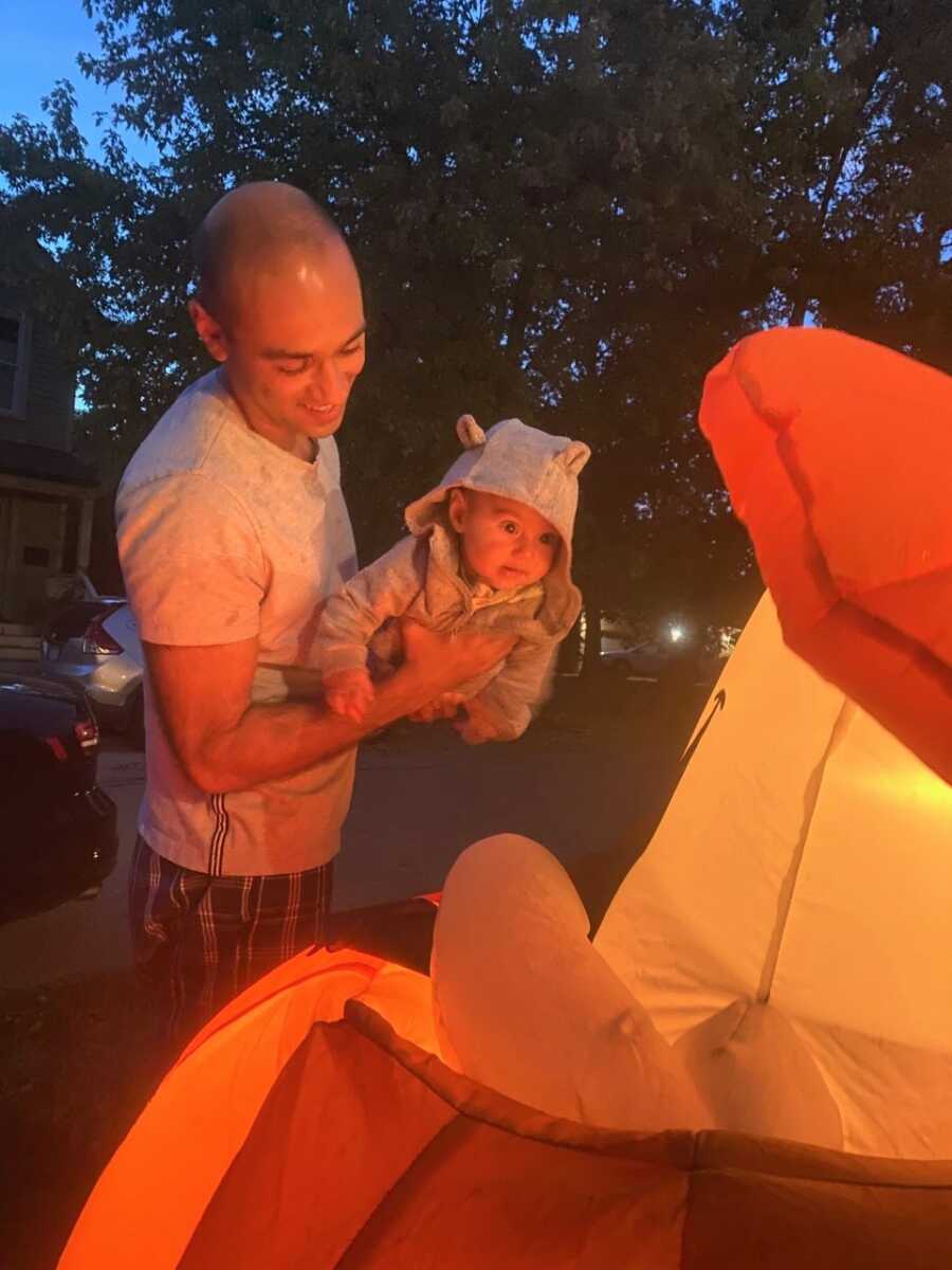 Sami's dad helps him get close to his favorite Halloween inflatable.
