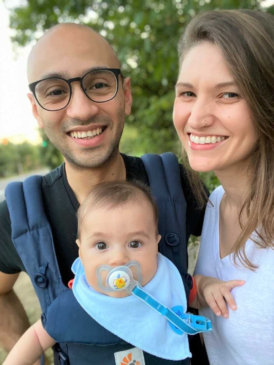 Faris and Michelle enjoying walks with Sami in the baby carrier. 