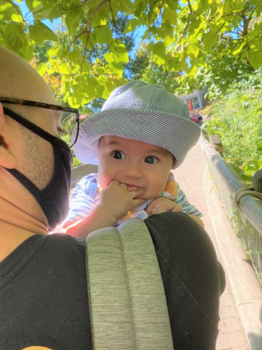 Sami enjoying visiting the zoo and seeing all the people. 