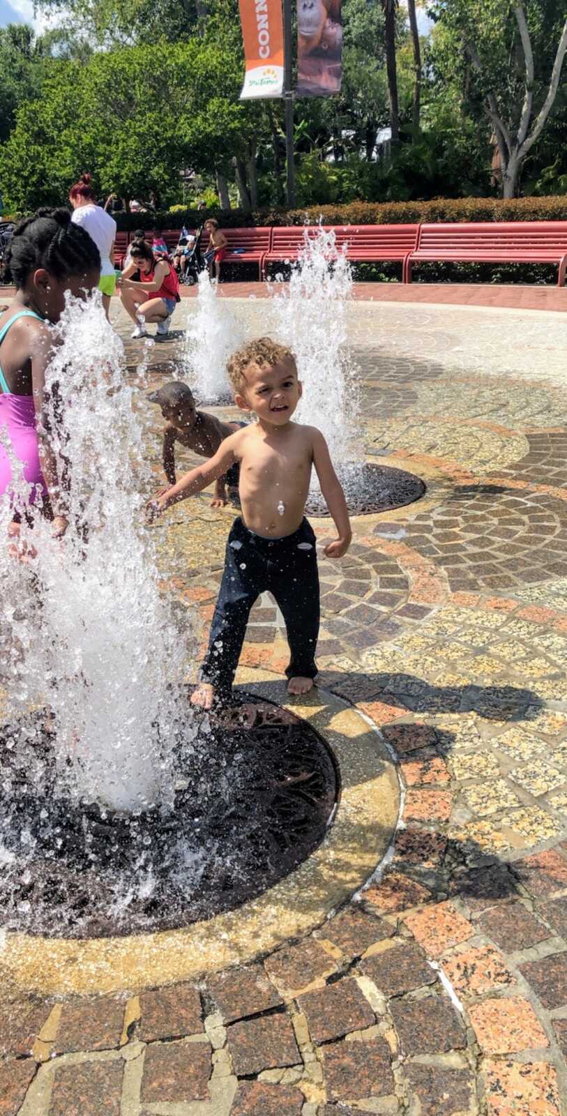 toddler boy outside with Mic-key button 