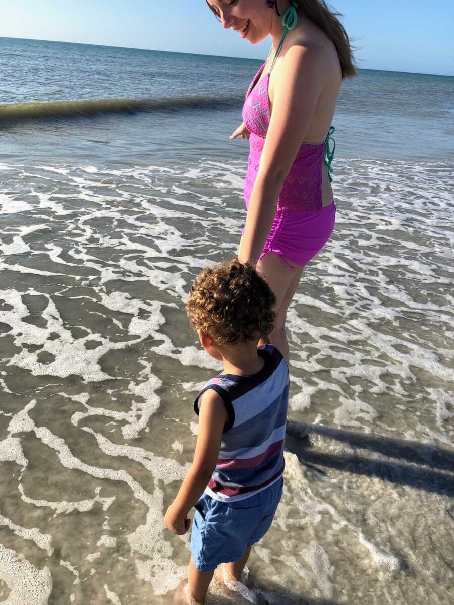 mom and son at the beach having fun