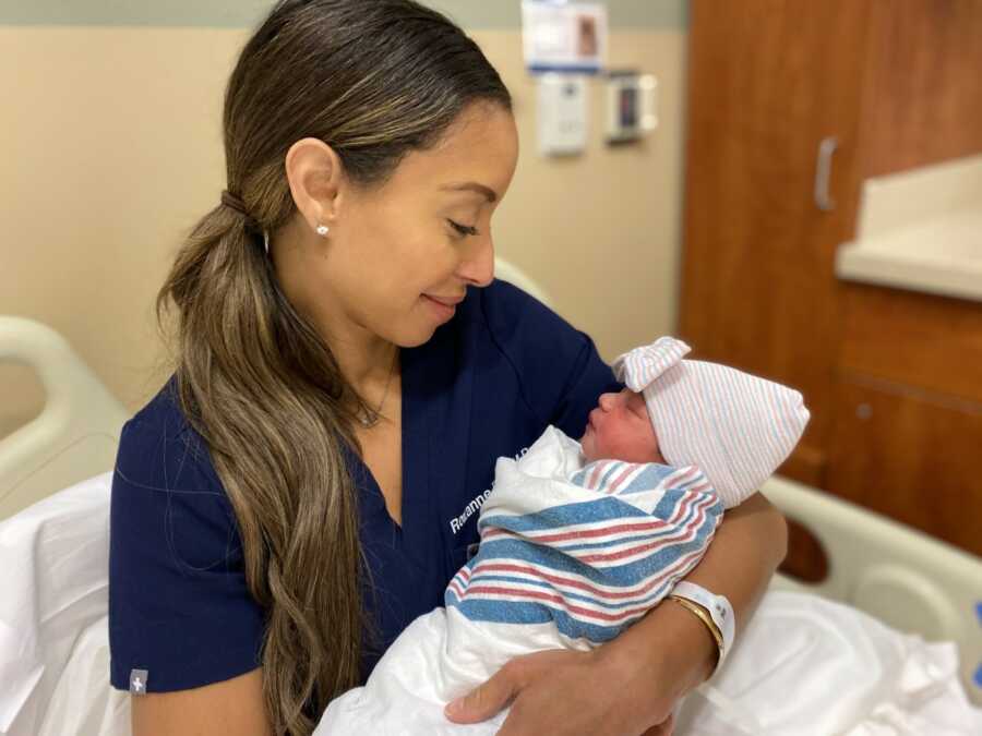 Roxanne holds their newborn baby girl. 