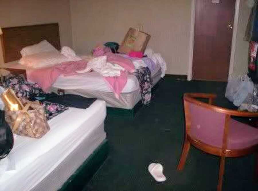 A cluttered, messy hotel room where Sarah and her friend would do drugs all weekend.