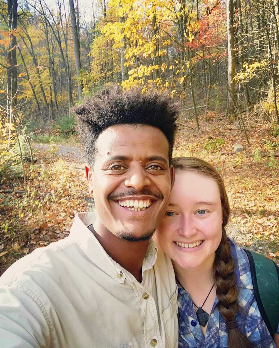 woman and her boyfriend in the forest hiking