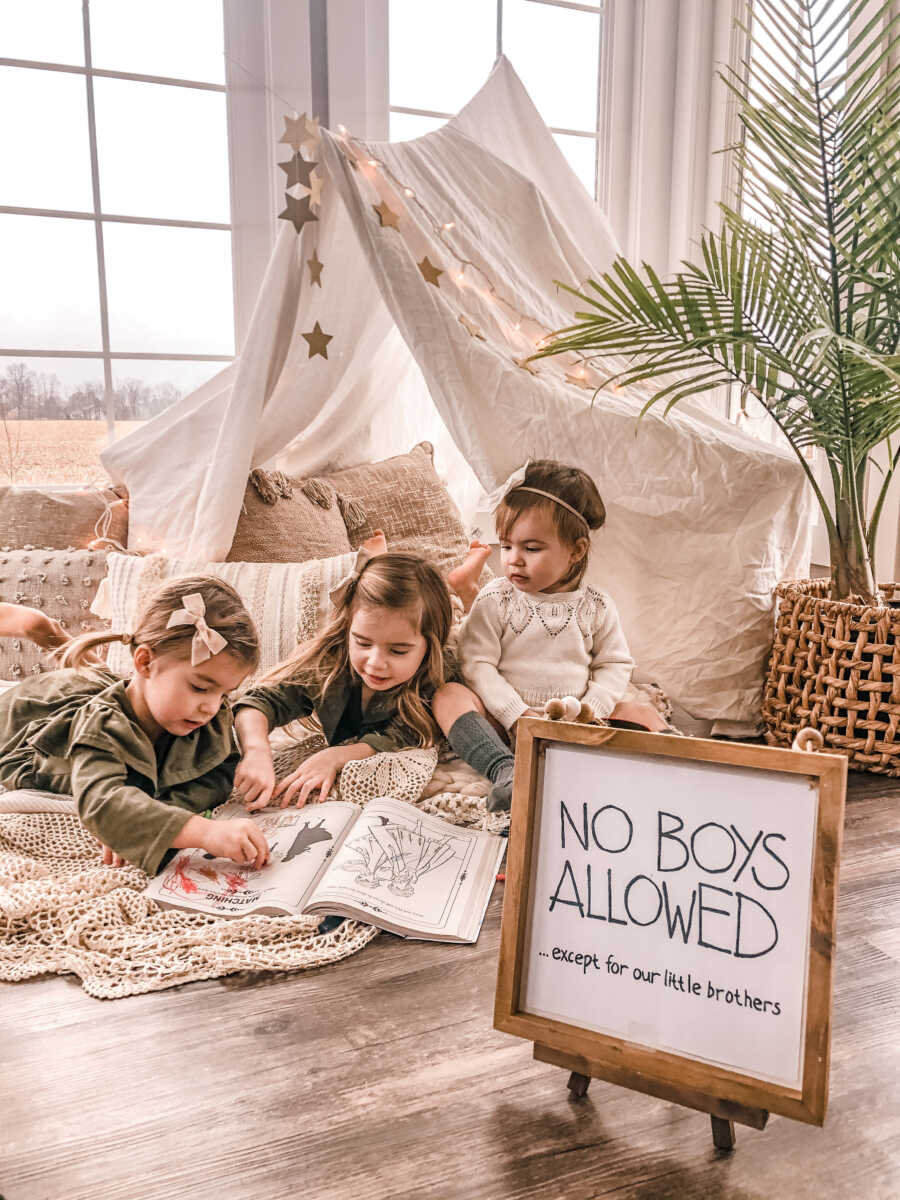 three sisters in their play room waiting for their brothers