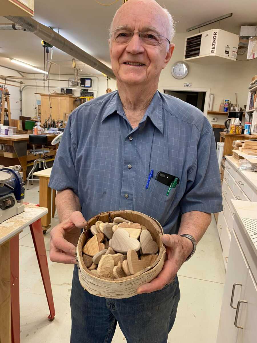 elderly man with his bowl of hearts that he made himself
