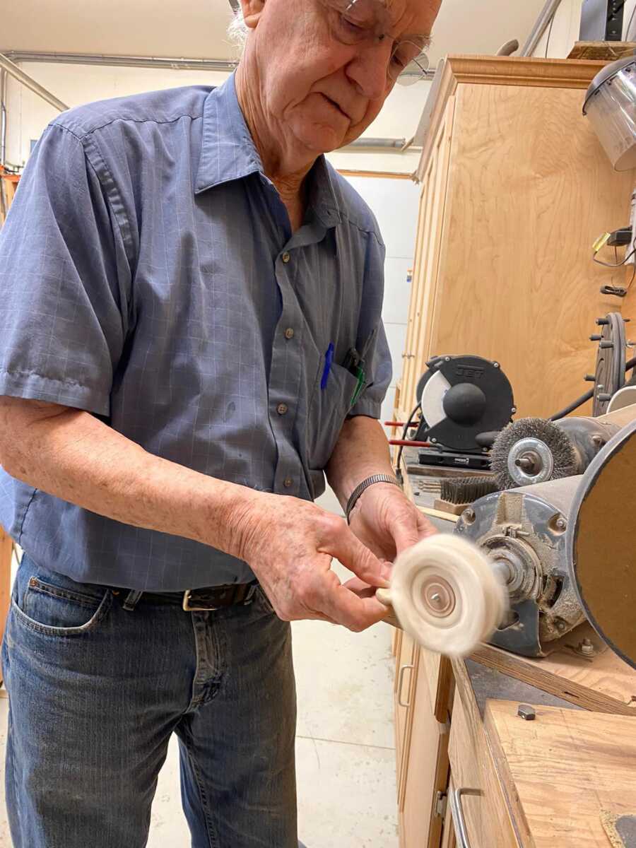elderly mad who makes his wood hearts 