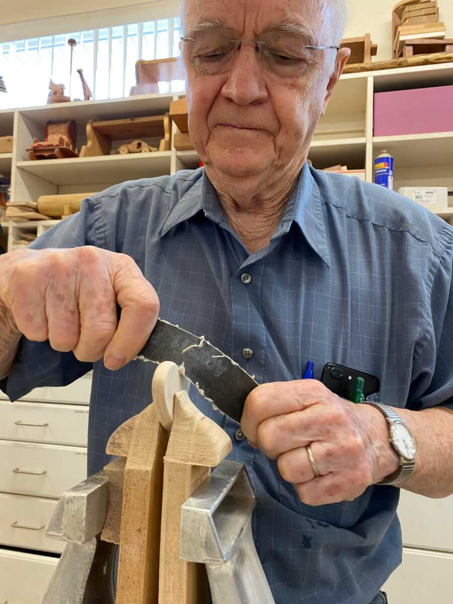 the process of making a wood heart by carving it out