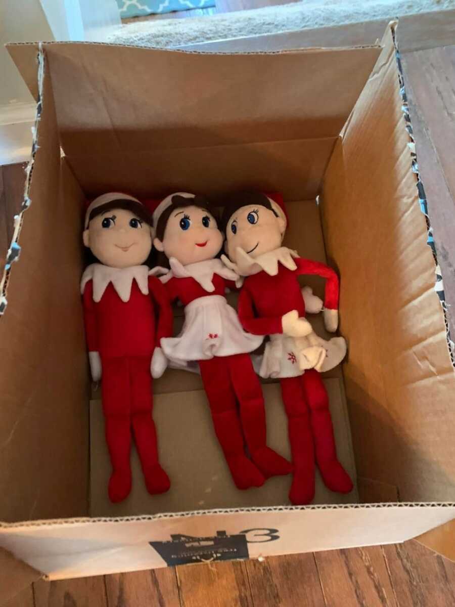 three elf on a shelf dolls to represent three kids