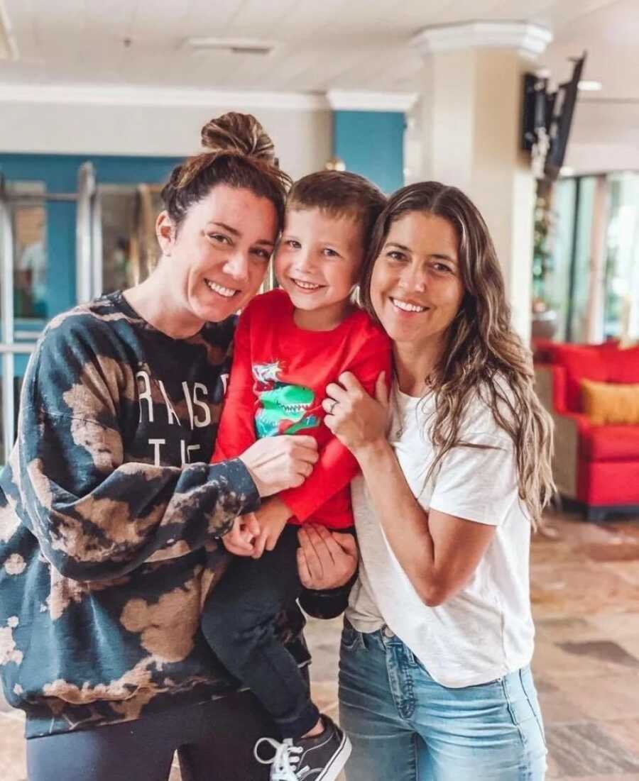 boy with mom and lady who saved him