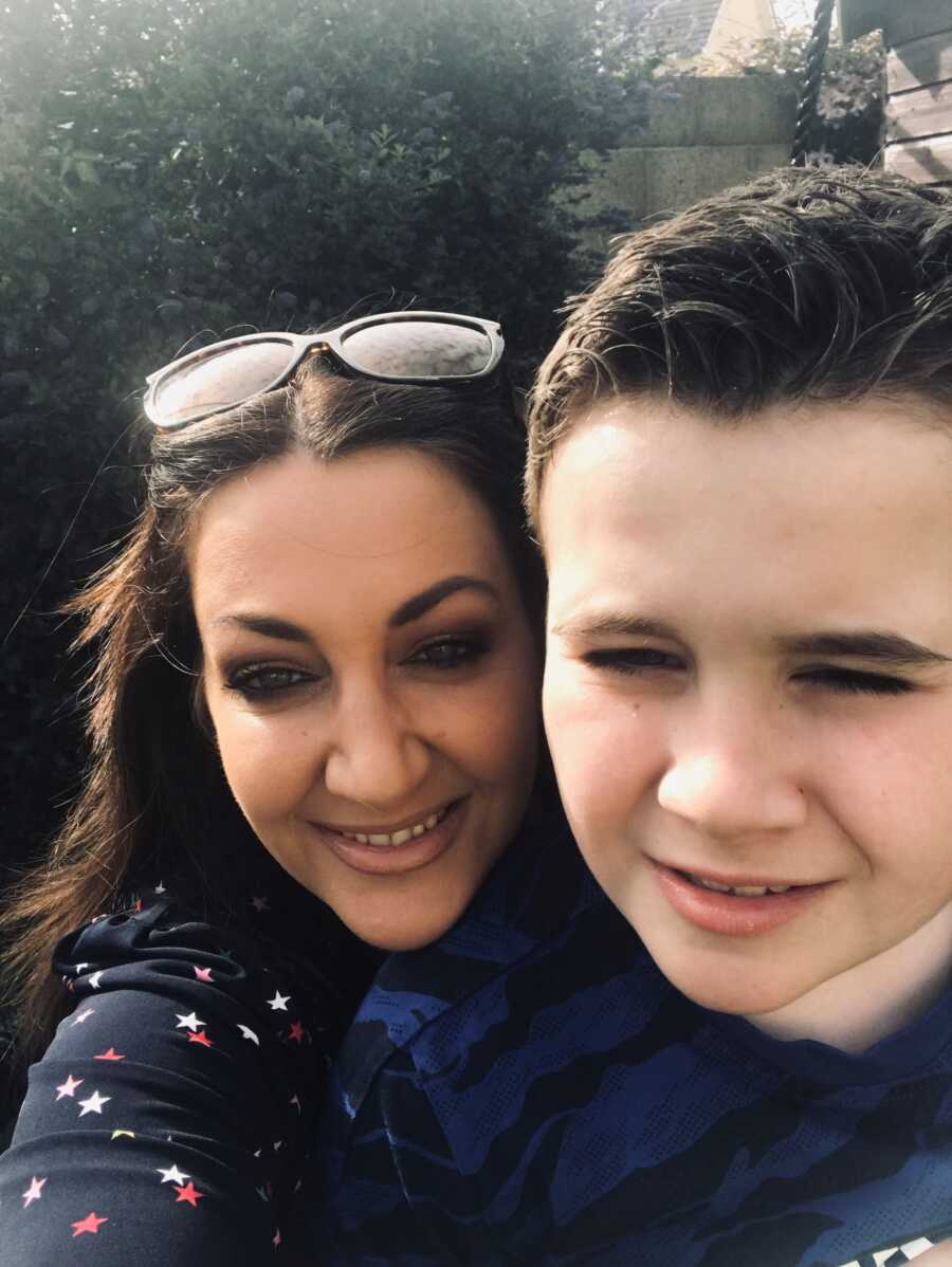 mom taking a selfie with her autistic son