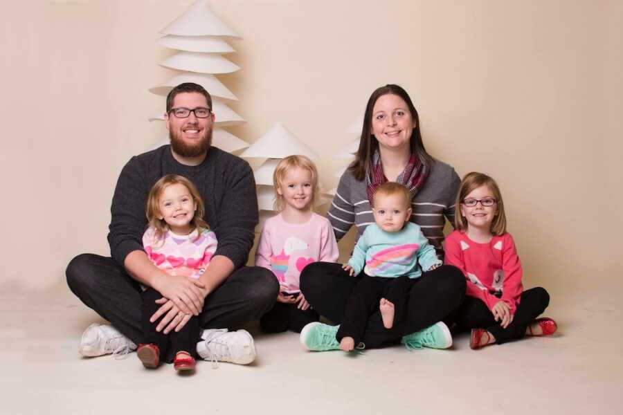 family of 6 sitting on the floor