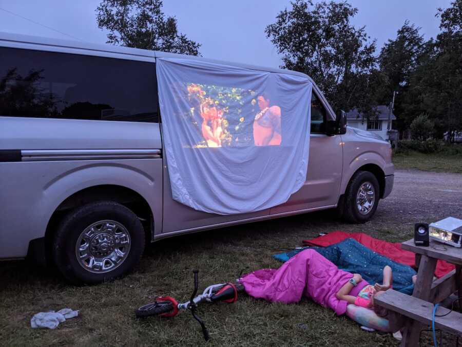 family watching movie on a projector