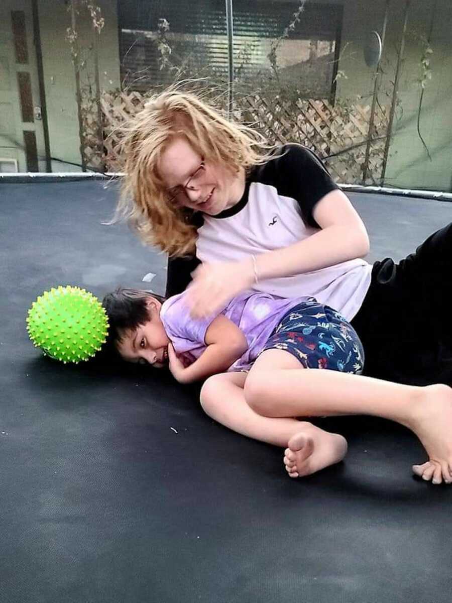 two kids on a trampoline