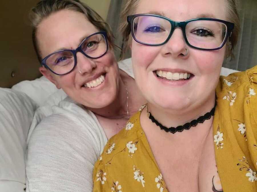 two moms smiling