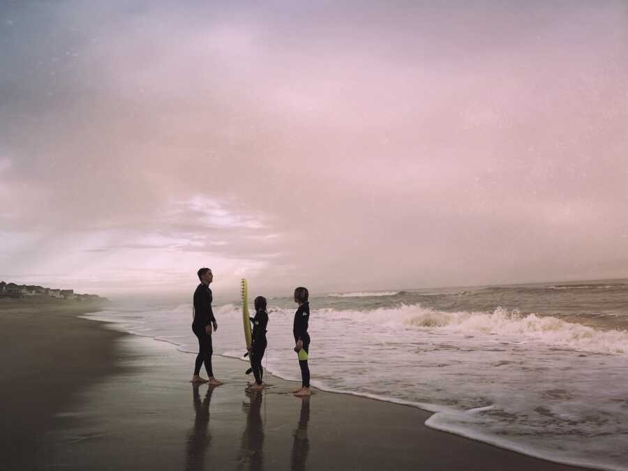 family surfing together during the holidays