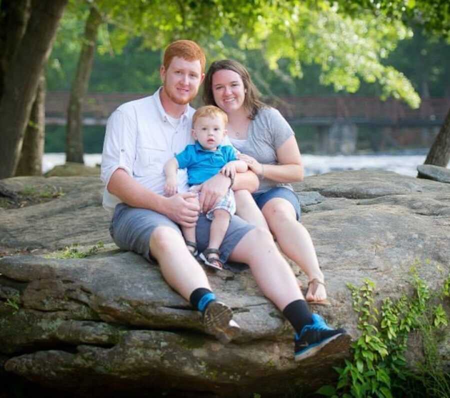 engagement photos of couple on a rock