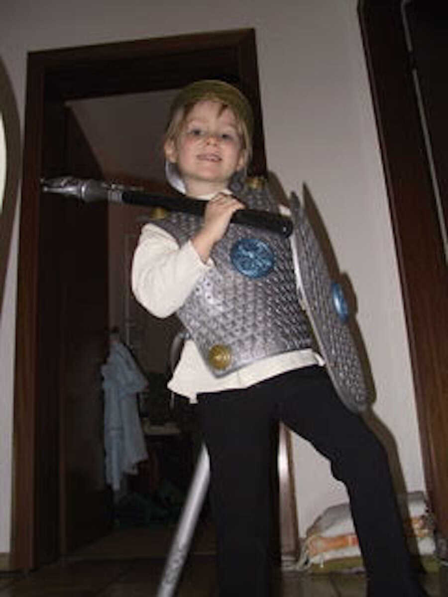 young girl in a knight's uniform