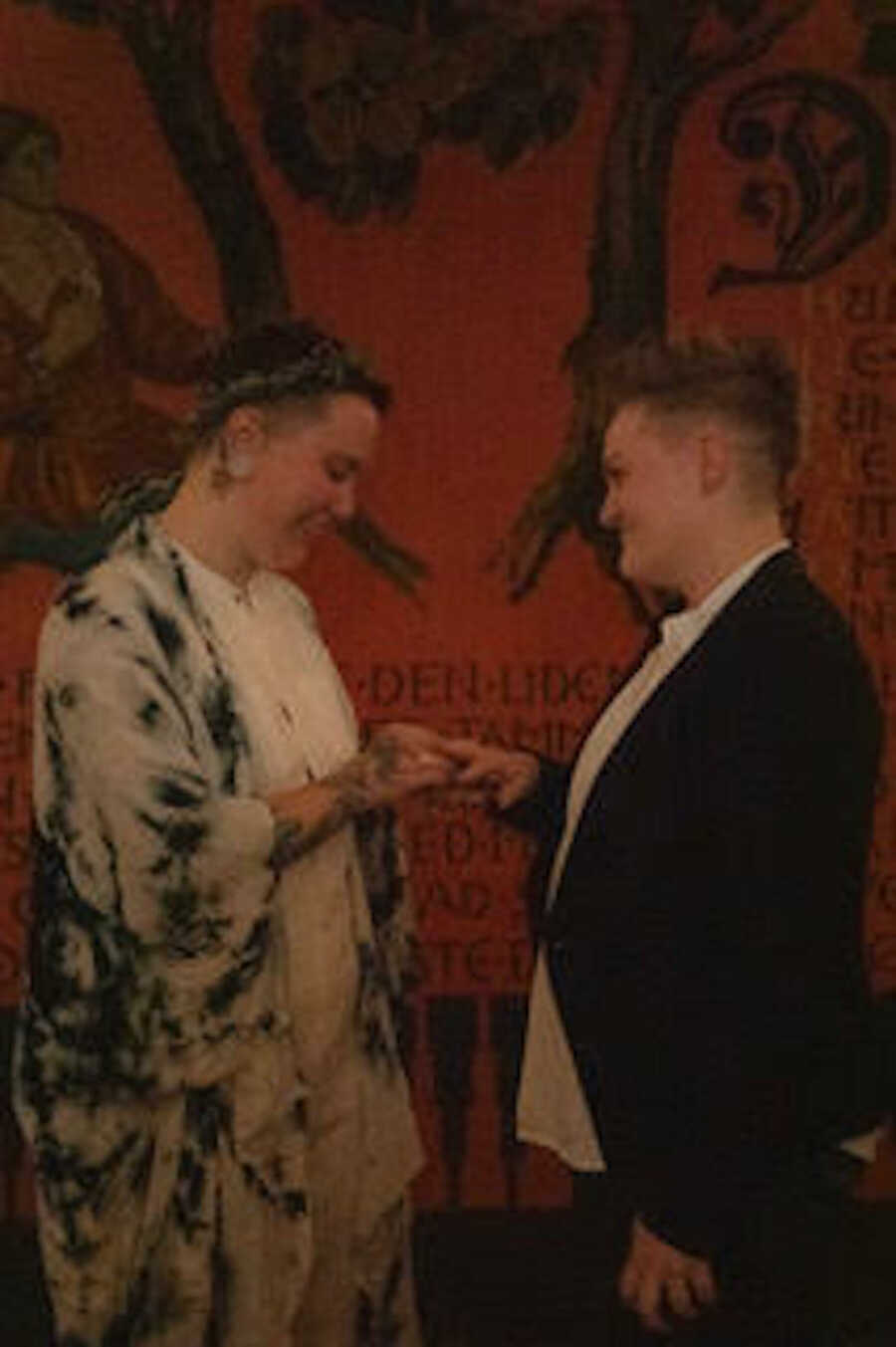 couple at their reception holding hands