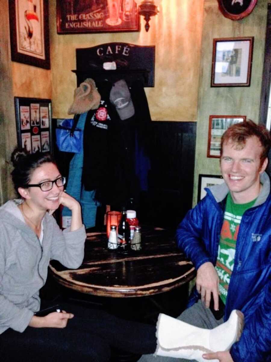 Couple take a photo together at a bar