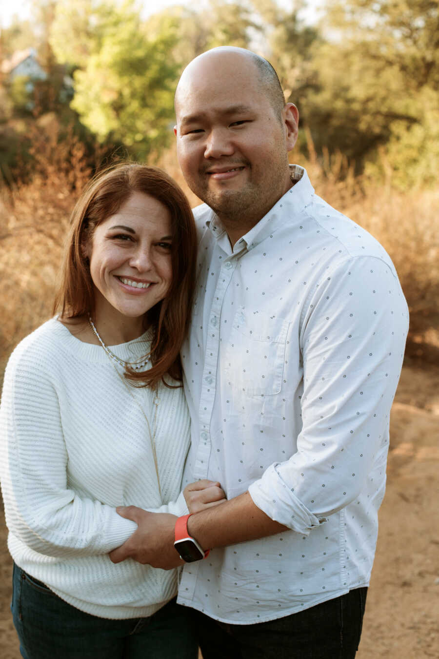 couple standing together outside