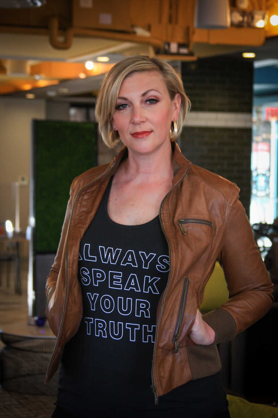 Jessica wears a shirt that says, 'Always speak your truth.'