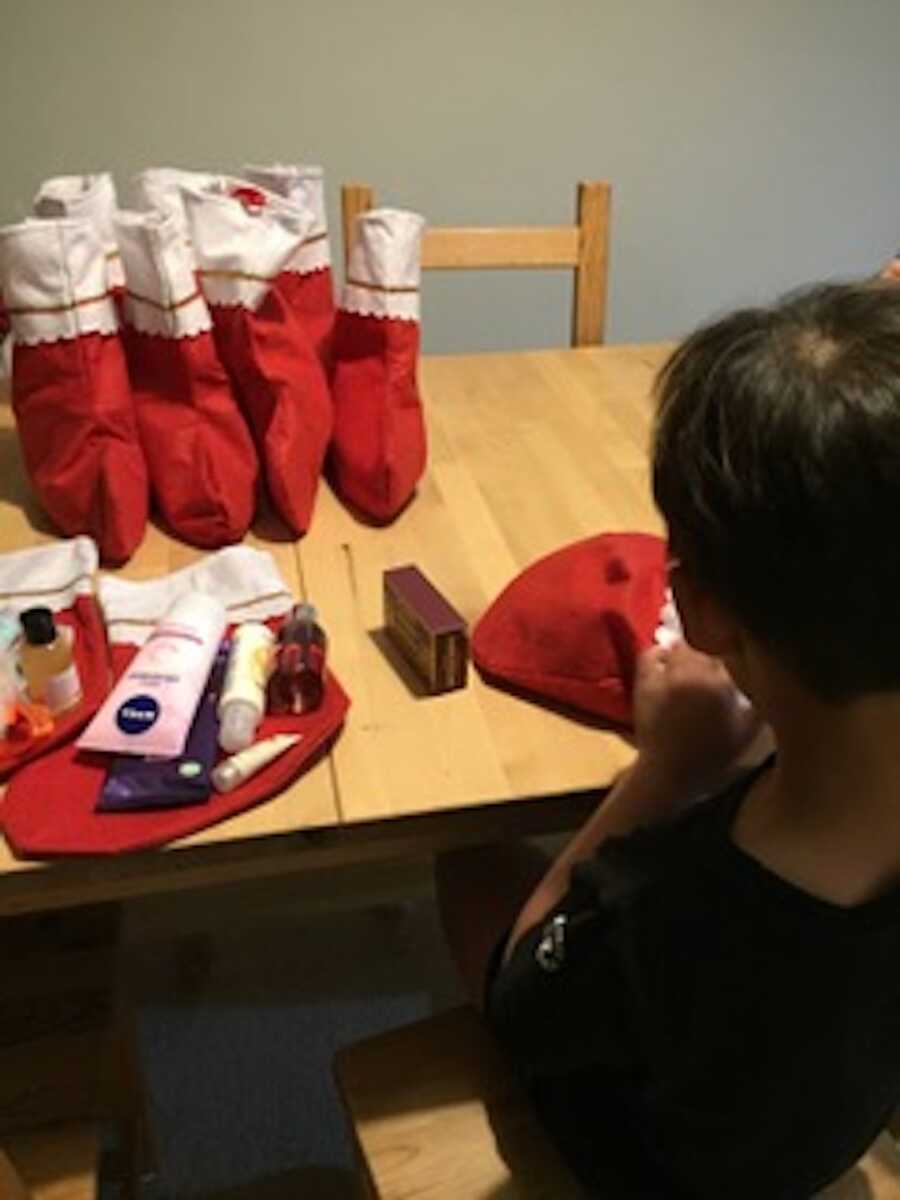 child stuffing stockings
