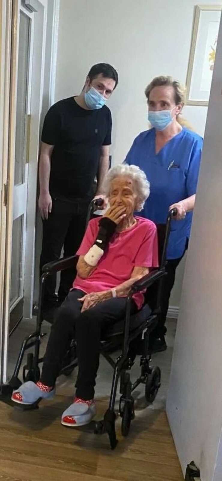 elderly woman being wheeled in to her husbands room