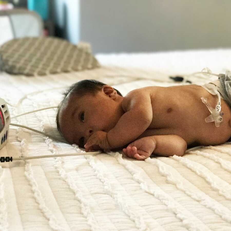 baby laying on the bed