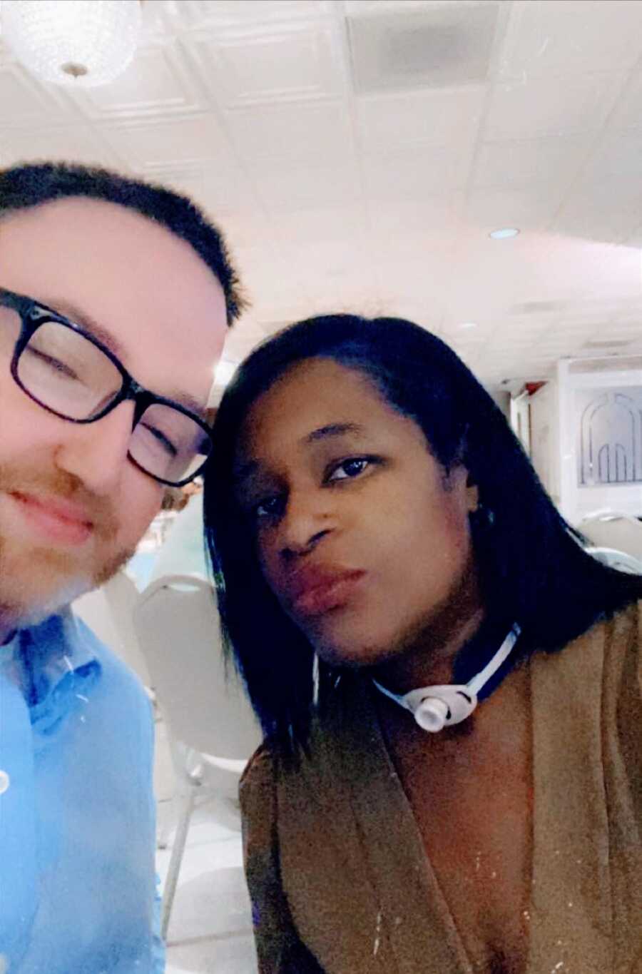 Couple take a selfie together while out to dinner