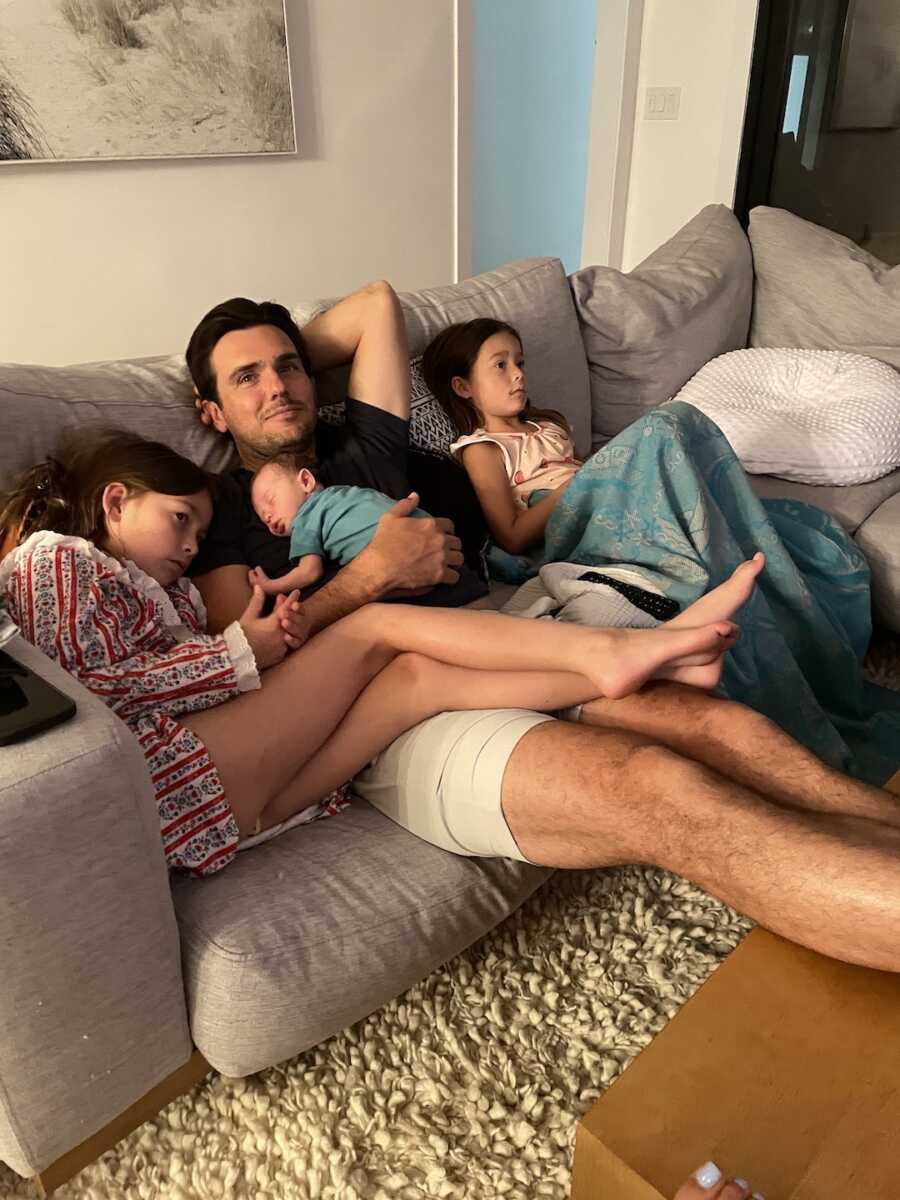 dad on the couch with his 3 kids