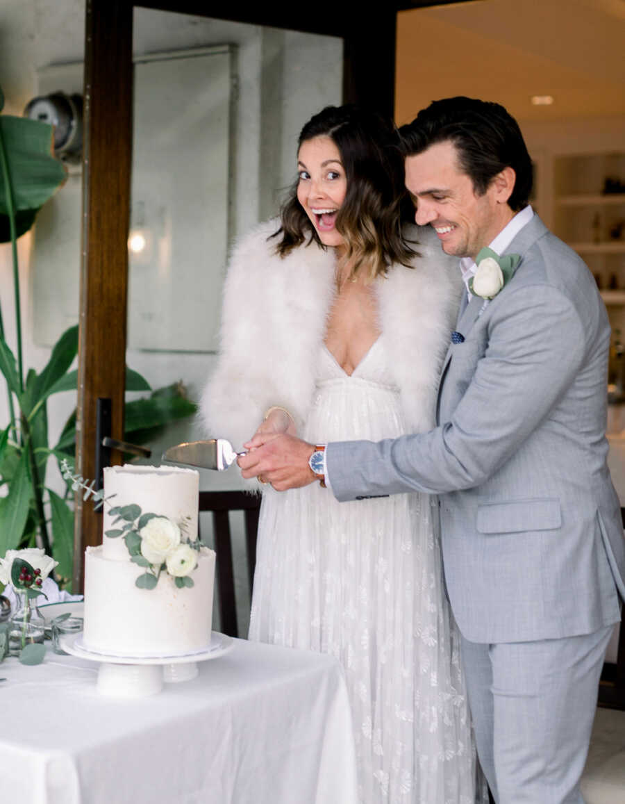 couple cutting the cake on their wedding day