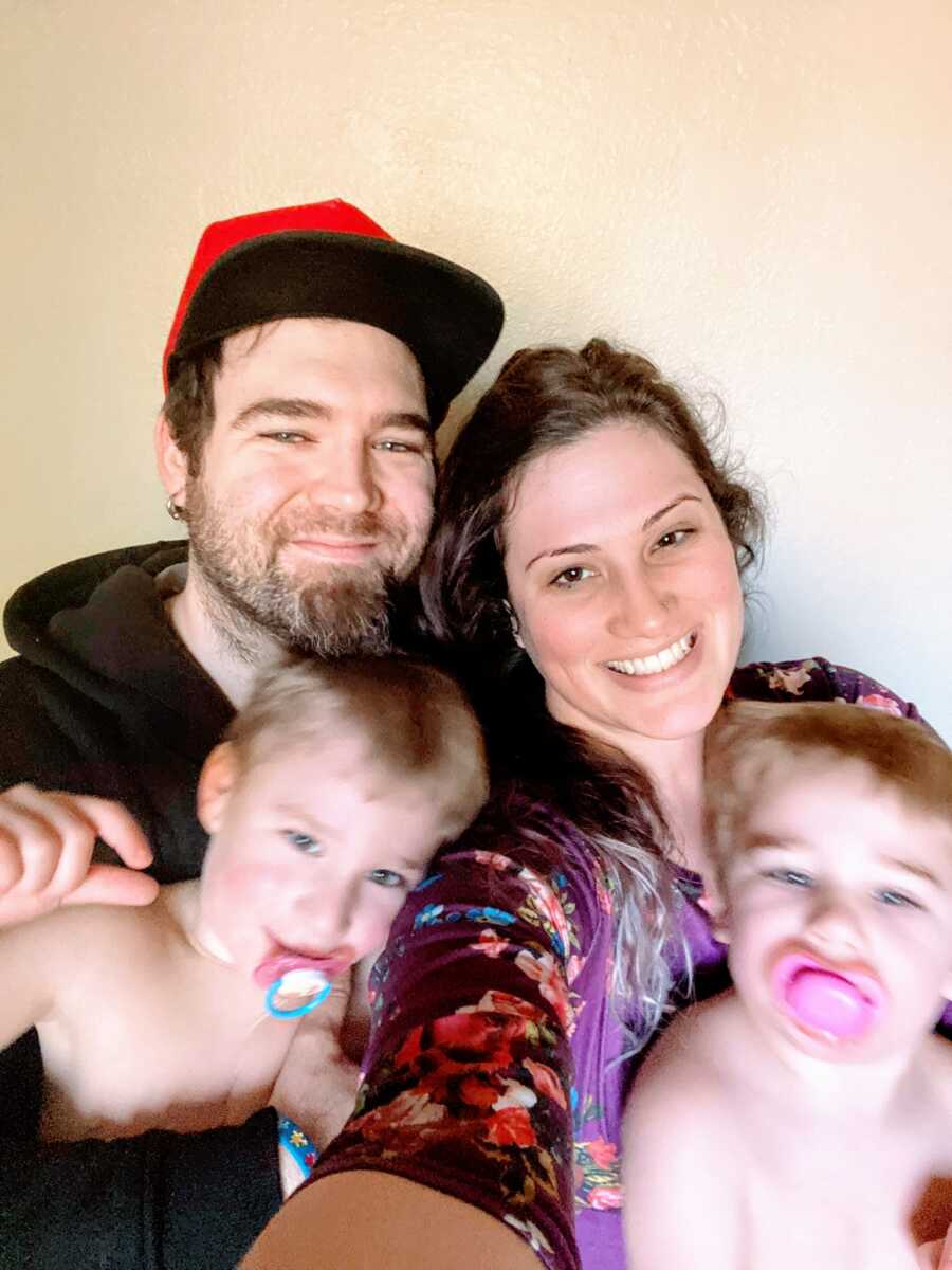 Couple separating take a blurry selfie with their children 