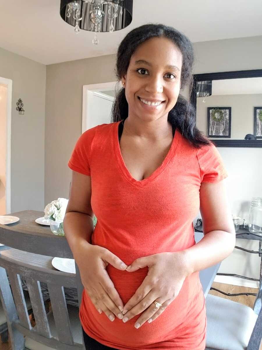Woman expecting her second child takes photo of her growing baby bump 