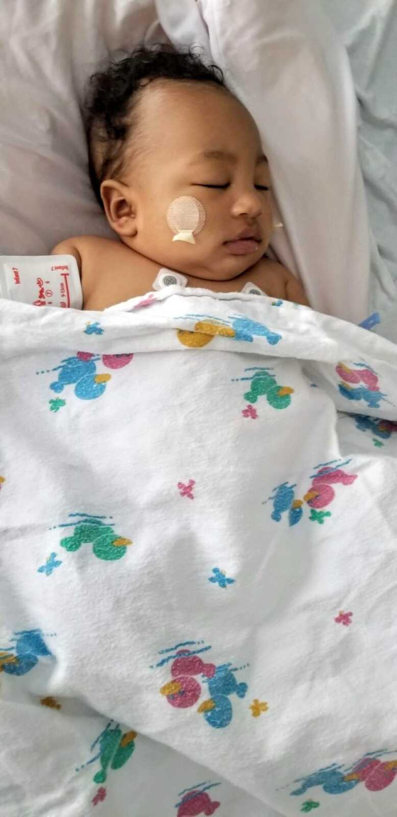 Little boy battling cancer sleeps in the hospital