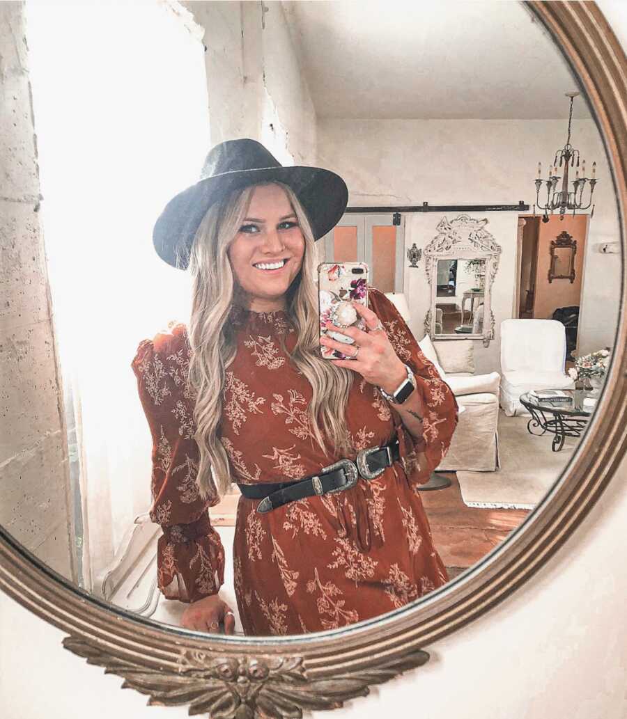 woman taking a mirror selfie