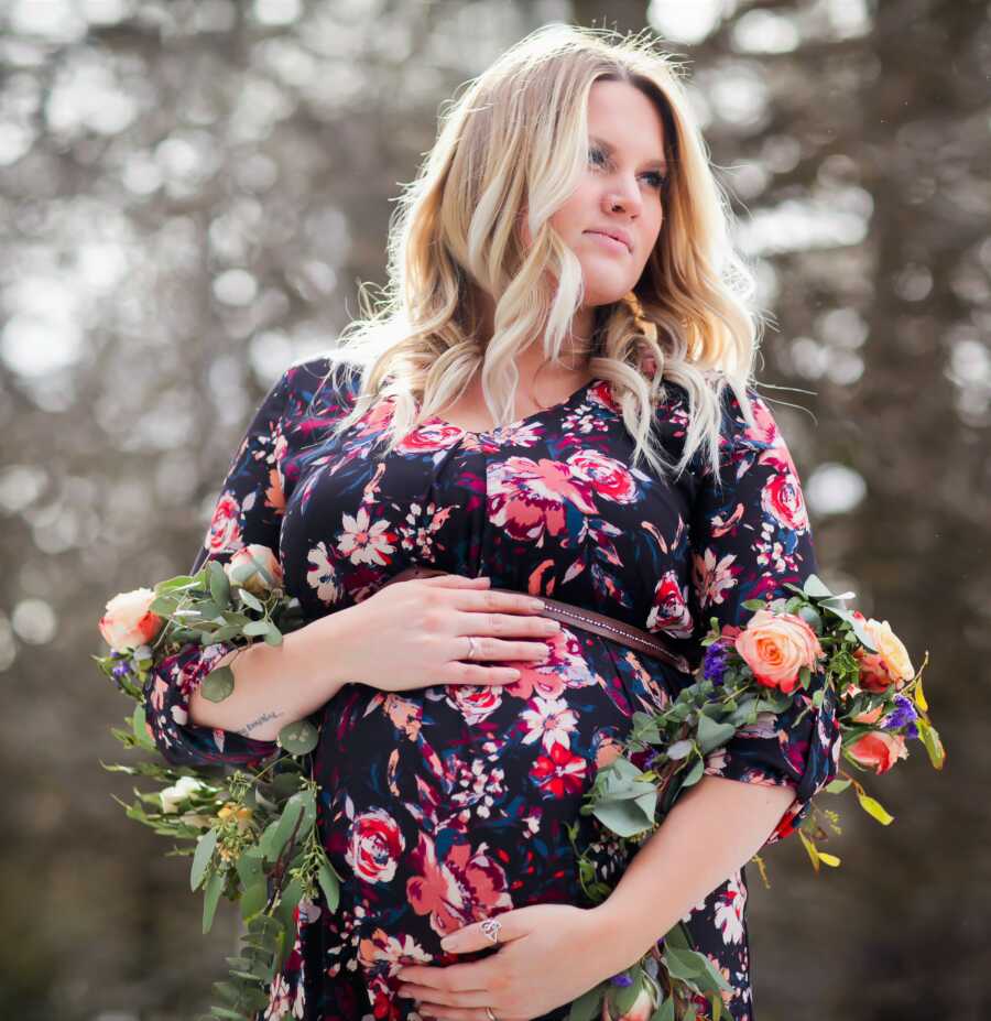 floral maternity photo of a young, blonde woman