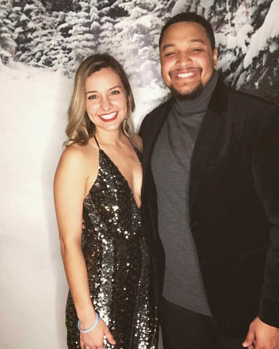 Couple poses for holiday picture together. 
