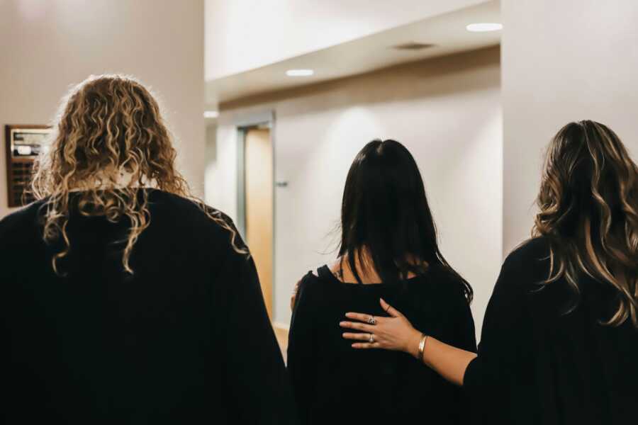 family walking out of the court room with their daughter