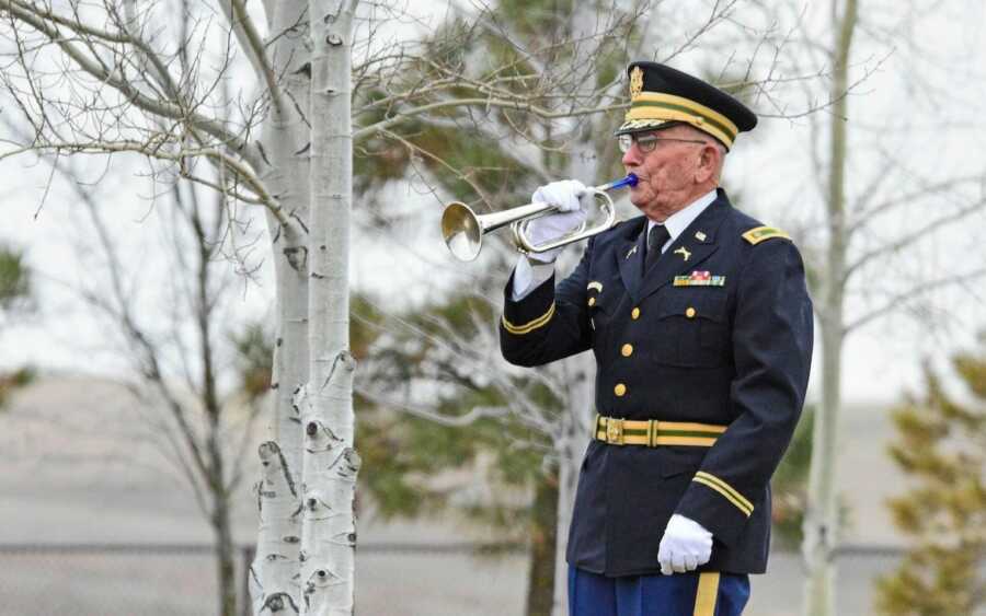 bugler playing at a veterans funeral