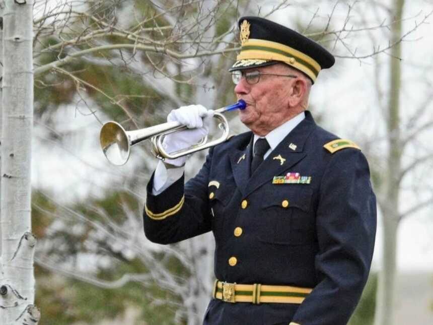 bugler playing at a veterans funeral