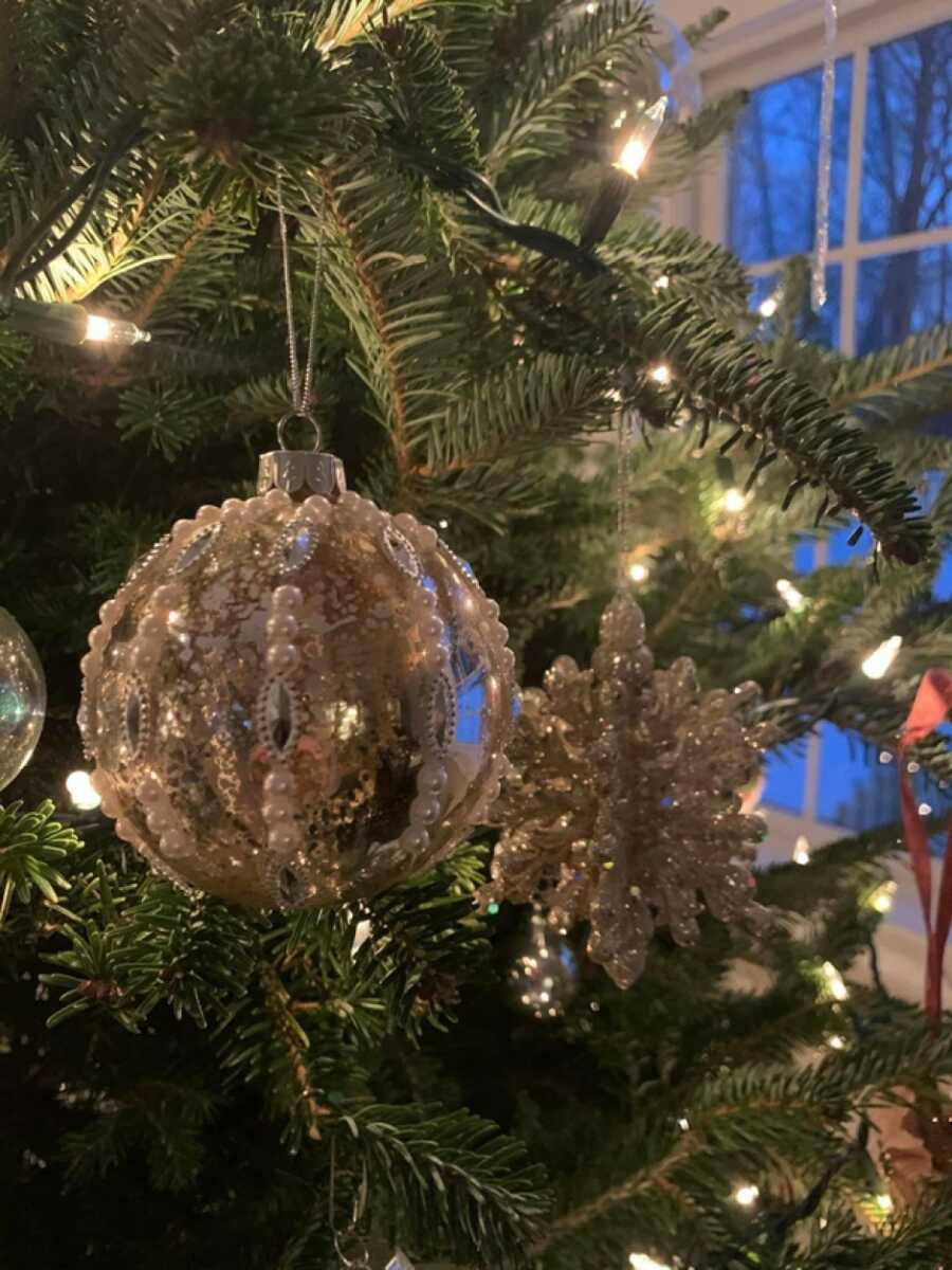 beautiful glittery ornament on a christmas tree