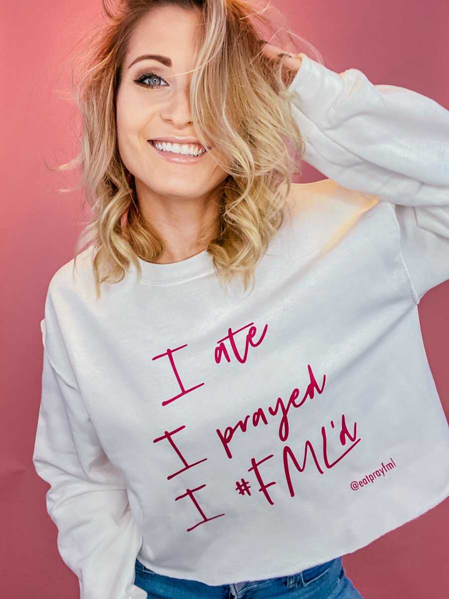 woman with a white shirt with her slogan with her pink background