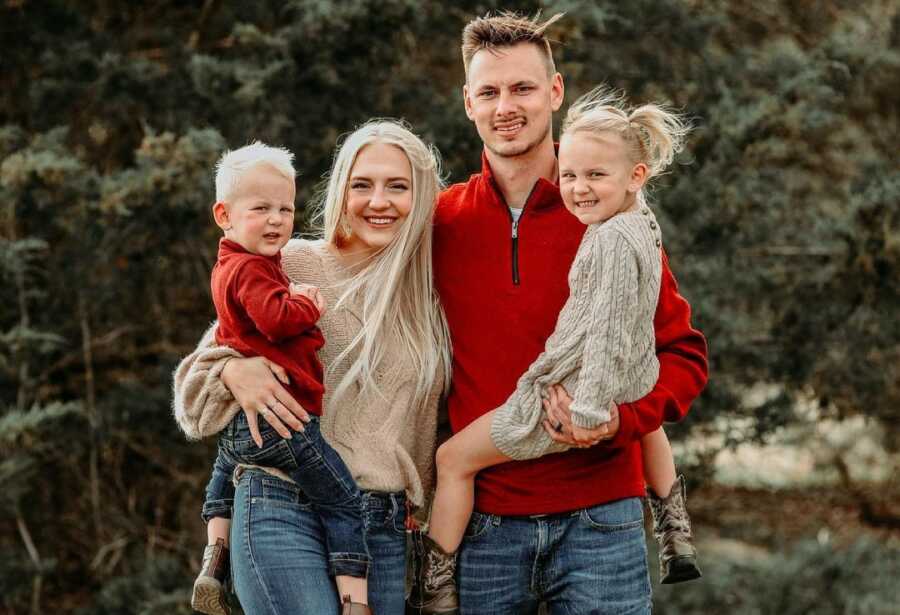 Family poses for pictures together. 